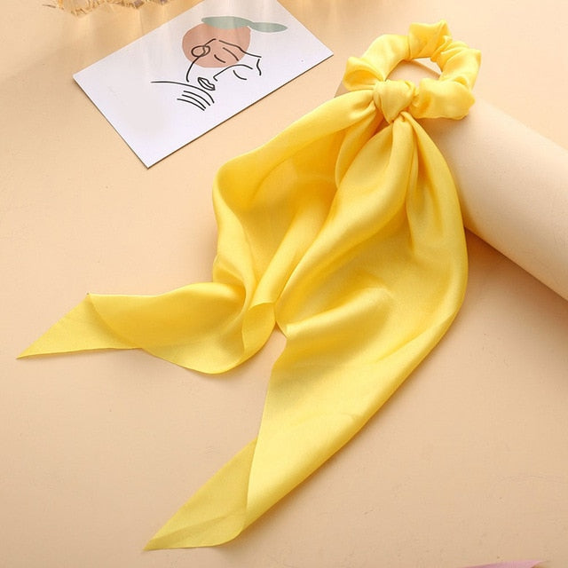 Élastique à cheveux en satin avec nœud papillon (13 couleurs)